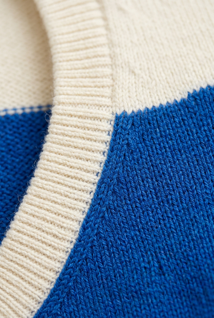 Ivory ribbed armhole and shoulder knit detail