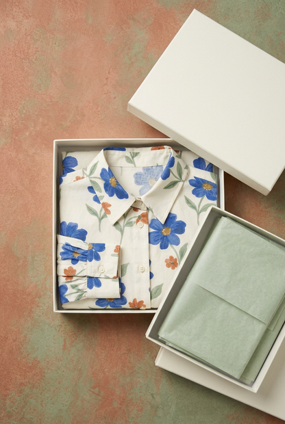 Floral blouse in blank ivory box with sage tissue