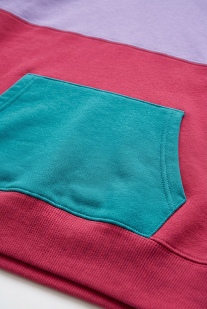 Teal kangaroo pocket against raspberry hoodie body