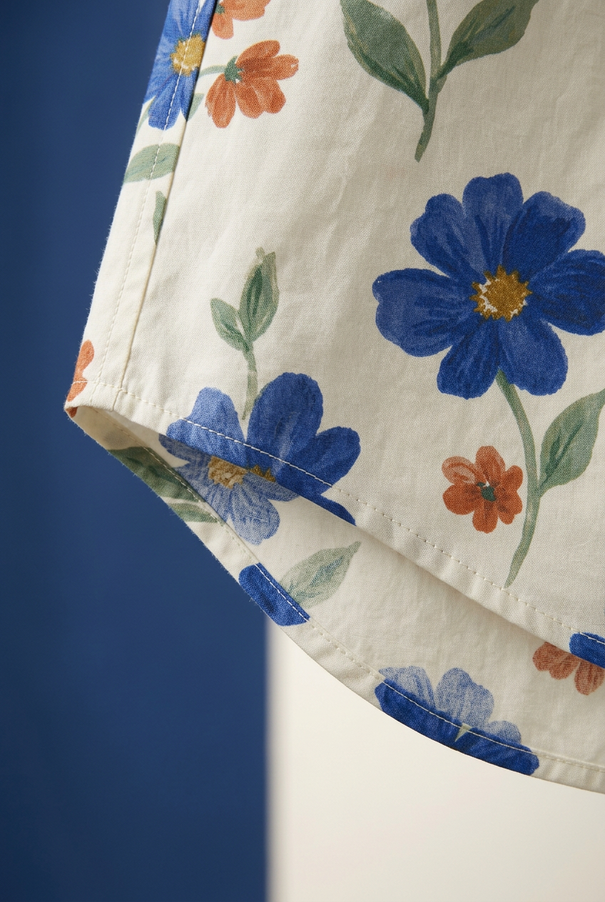 Curved shirttail hem and floral print detail