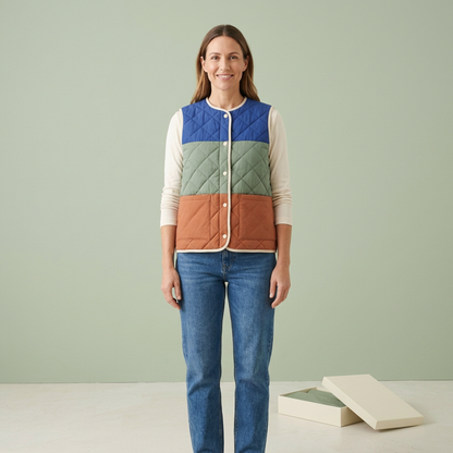 Model layering quilted vest over plain ivory long sleeve top