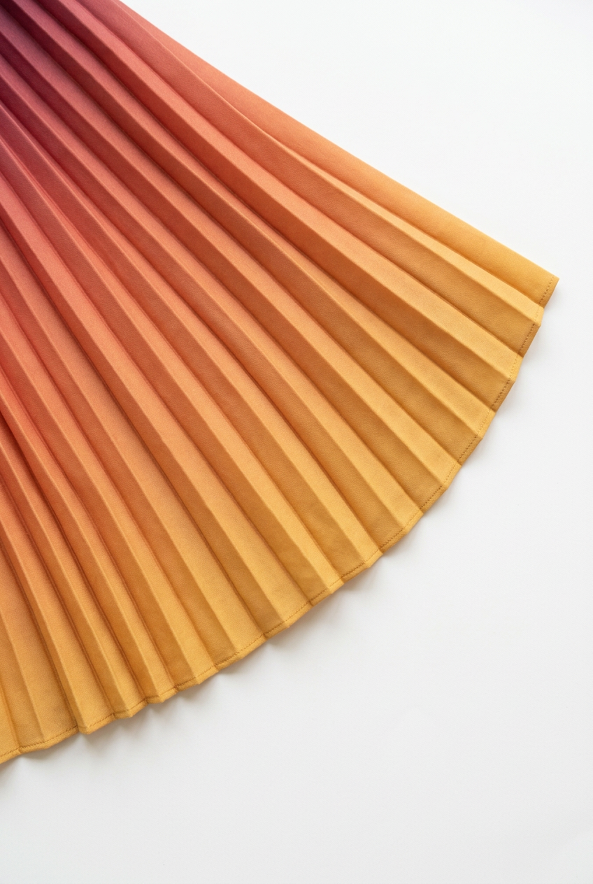 Golden yellow pleated skirt hem detail